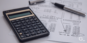Documents with pencil and calculator